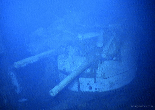 Y turret of HMAS Sydney with various pieces of wreckage strewn across its top.