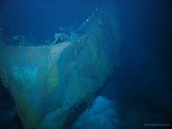 The buckled stern and collapsed quarterdeck of the wreck.