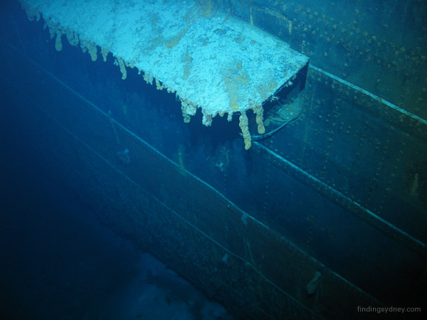 Above water torpedo port on the starboard side of Kormoran, with a simple rectangular steel flap in the open position.