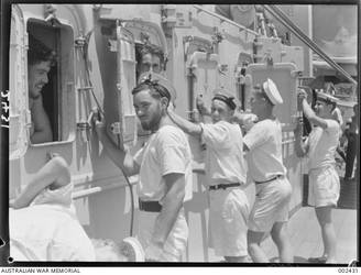 Unidentified crew of HMAS Sydney cleaning ship.