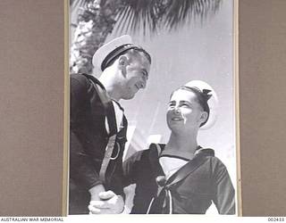 Crew members of HMAS Sydney outside the Fleet Club on leave. They are Able Seaman (AB) R. McKinnon and Ordinary Seaman (later AB) Peter Frederick Milverton. Milverton was later killed in action on 20 November 1941 when the HMAS Sydney was lost with all hands after an engagement with the Kormoran.