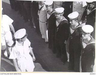 HMAS SYDNEY LIBERTY MEN BEING INSPECTED BEFORE LEAVING SHIP TO GO ASHORE.