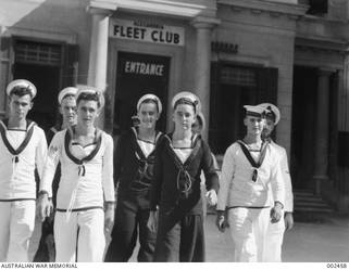 ALEXANDRIA, EGYPT. CREW MEMBERS OF HMAS SYDNEY LEAVING THE MEN'S MESS AT THE ALEXANDRIA FLEET CLUB AFTER A TRIP ASHORE.