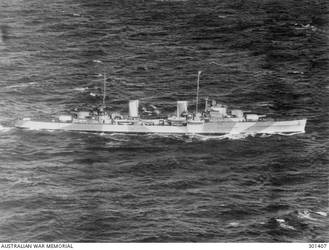1941-08-01. STARBOARD SIDE VIEW OF THE CRUISER HMAS SYDNEY (II) (EX HMS PHAETON) WITH HER AIRCRAFT EMBARKED. NOTE THE SPAR PROJECTING FORWARD OF THE BRIDGE AND THE SINGLE 4 INCH AA GUNS AMIDSHIPS, WHICH DISTINGUISHED THE SYDNEY FROM HER TWO SISTERS HOBART AND PERTH NOTE THE CAMOUFLAGE SCHEME, THE COLOURS OF WHICH ARE PROBABLY 507A (THE DARKER GREY) AND 507C. IT IS ALMOST IDENTICAL ON THE PORT SIDE. (NAVAL HISTORICAL COLLECTION)
