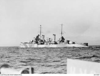 1941-08-01. PORT QUARTER VIEW OF THE CRUISER HMAS SYDNEY (II) (EX HMS PHAETON) WITH HER AIRCRAFT EMBARKED. NOTE THE SINGLE 4 INCH AA GUNS AMIDSHIPS, WHICH DISTINGUISHED THE SYDNEY FROM HER TWO SISTERS HOBART AND PERTH NOTE THE CAMOUFLAGE SCHEME, THE COLOURS OF WHICH ARE PROBABLY 507A (THE DARKER GREY) AND 507C. IT IS ALMOST IDENTICAL ON THE STARBOARD SIDE. (NAVAL HISTORICAL COLLECTION)