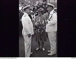 COCKATOO ISLAND DOCKYARD, SYDNEY, NSW. 1940-02-10. DIGNITARIES AT THE LAUNCHING OF THE SLOOP HMAS WARREGO (II). LEFT TO RIGHT: ENGINEER REAR ADMIRAL P. E. MCNEILL CBE RAN, THIRD NAVAL MEMBER; MRS R. G. MENZIES, WIFE OF THE PRIME MINISTER AND LAUNCHING LADY; PAYMASTER CAPTAIN J. B. FOLEY CBE RAN, SECRETARY TO THE FIRST NAVAL MEMBER. (NAVAL HISTORICAL COLLECTION).