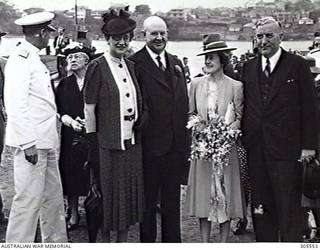 COCKATOO ISLAND DOCKYARD, SYDNEY, NSW. 1940-02-10. DIGNITARIES AT THE LAUNCHING OF THE SLOOP HMAS WARREGO (II). LEFT TO RIGHT: ADMIRAL SIR RAGNAR COLVIN KBE CB RN, FIRST NAVAL MEMBER; UNIDENTIFIED; LADY DAVIS; SIR GEORGE DAVIS KT, CHAIRMAN OF DIRECTORS, COCKATOO DOCK AND ENGINEERING COY PTY LTD; THE WIFE OF THE PRIME MINISTER AND LAUNCHING LADY, MRS R. G. MENZIES; THE PRIME MINISTER, MR R. G. MENZIES. (NAVAL HISTORICAL COLLECTION).
