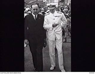 COCKATOO ISLAND DOCKYARD, SYDNEY, NSW. 1940-02-10. MR ERIC HARRISON MHR (LEFT) WITH ADMIRAL SIR RAGNAR COLVIN KBE CB RN, FIRST NAVAL MEMBER, ON THE OCCASION OF THE LAUNCHING OF THE SLOOP HMAS WARREGO (II). (NAVAL HISTORICAL COLLECTION).