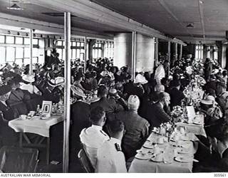 COCKATOO ISLAND DOCKYARD, SYDNEY, NSW. 1940-02-10. CROWED TABLES AT THE LUNCHEON AFTER THE LAUNCHING OF THE ESCORT SLOOP HMAS WARREGO (II). (NAVAL HISTORICAL COLLECTION).