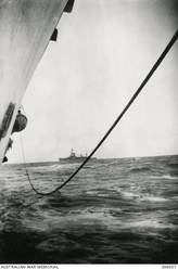 OFF COCOS KEELING ISLANDS. 1940-04-20. THE FRENCH CRUISER SUFFREN SEEN FROM THE CRUISER HMAS SYDNEY (II). THE SUFFREN IS TO TAKE OVER THE ESCORT OF CONVOY US.2, THE SECOND CONVOY OF AUSTRALIAN AND NEW ZEALAND FORCES FOR THE MIDDLE EAST. (NAVAL HISTORICAL COLLECTION).