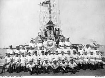Alexandria, Egypt (?). c.1940-07. Group portrait of some of the crew members aboard HMAS Sydney II possibly following their successful action against the Italian cruiser Bartolomeo Colleoni off Cape Spada, Crete, on 19 July 1940. The Sydney was ultimately sunk off Carnarvon, WA, on 19 November 1941 following a fierce battle with the German raider Kormoran, which also sank. All 645 crew members aboard the HMAS Sydney were lost. (Original print held in AWM- Archive Store) (Donor N. Scott)