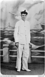 Studio portrait of 23467 Cook Merton James Morphett, RAN, of Penrith, NSW. Enlisting on 8 August 1939, he served aboard the HMAS Sydney (II). He was killed in action, aged 20, when the HMAS Sydney was sunk in the Indian Ocean on 20 November 1941 while battling with the German Raider, HSK Kormoran.