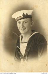 Studio portrait of 23368 Stoker John McGhie Peak of Boyanup, WA. Enlisting in the RAN in July 1939, Stoker Peak was killed on board HMAS Sydney II when it was sunk by the German auxiliary cruiser Kormoran on 20 November 1941.