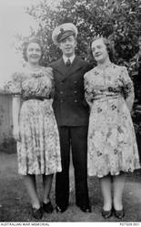 Informal outdoor portrait of 21233 Steward (Std) Eric Norman Finn of Oakleigh, SA, with two unidentified ladies. Enlisting in the RAN in September 1936, Std Finn was on board HMAS Sydney II during its service in the Mediterranean before being discharged in July 1941 and re-enlisting in the Army as a Lance Corporal (LCpl) in September 1941 with the serial number VX64081. Serving in the Pacific campaign with the 2/29 Battalion, LCpl Finn was captured by Japanese forces at Singapore in February 1942, and died of illness whilst a prisoner of war on 26 June 1943. At the time of his death, LCpl Finn was aged 25.