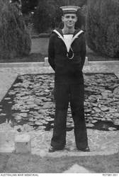 Informal outdoor portrait of 24146 Stoker II (Sto II) Cyril Brien Collie of Bulimba, Qld. Enlisting in the RAN in March 1940, Sto III Collie was on board HMAS Sydney II when it was sunk by the German auxiliary cruiser Kormoran on 20 November 1941 with the loss of all 645 crew members.