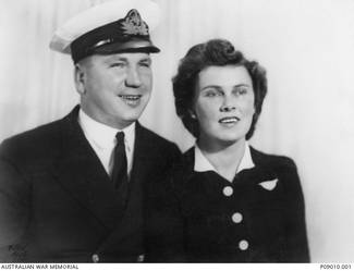 Studio portrait of Schoolmaster Percy Francis Skewes, HMAS Sydney, and his wife Mina (nee Glover). Schoolmaster Skewes enlisted in the RAN on 23 October 1939. He was killed in action, aged 26, when HMAS Sydney II was sunk in the Indian Ocean by the German auxiliary cruiser Kormoran on 20 November 1941.