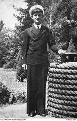 Outdoor portrait of 24581 Assistant Steward George William Coppin, of Semaphore, SA. Assistant Steward Coppin enlisted in the RAN on 2 September 1940. Whilst serving on HMAS Sydney II, he was killed in action when the Sydney was sunk in the Indian Ocean by the German auxiliary cruiser Kormoran on 20 November 1941. He was aged 18.