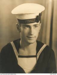 Studio portrait of 23253 Stoker (Sto) Snowden Edward Love, HMAS Sydney II, of Redfern, NSW (previously of Katanning, WA). Sto Love enlisted in the RAN on 2 June 1939. He was killed in action aged 21, when HMAS Sydney II was sunk in the Indian Ocean by the German auxiliary cruiser Kormoran on 20 November 1941.