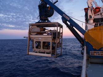 ROV being lowered into the water by crane