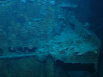 Damage to aft end, port, forward superstructure