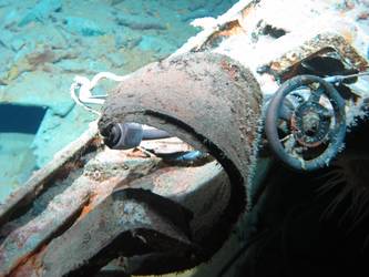 Wreckage on seabed near forward part of ship showing valve wheel