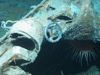 Wreckage on seabed near forward part of ship showing valve wheel