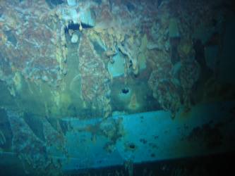 Shell hits beneath superstructure on Ship's port side