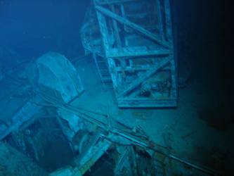 Rear of ship's aircraft crane, hole in deck where funnel torn away