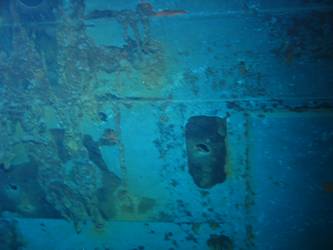 Shell hit on port side of ship
