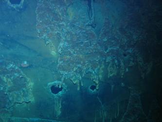 Shell hit on port side of ship