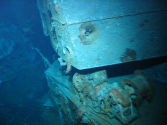 Shell hit on right hand side of X turret gun house