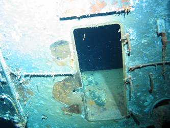 Rear of X turret showing damage and hatch doors open