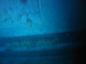 Shell hit above boot topping on stbd side below 4-inch gun deck