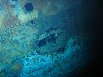 Hole in ship's side in vicinity of forward superstructure