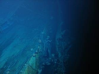 Stbd side of Sydney near A turret showing ship side peeled Back