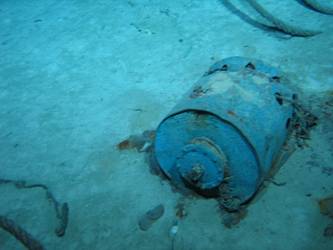 Unidentified cylindrical drum on seabed