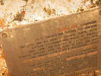 Brass tally plate on side of quadruple torpedo mount