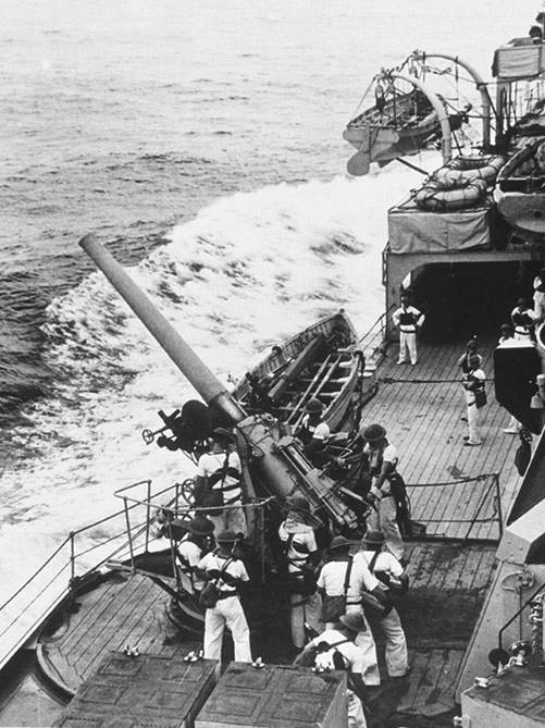 Crew of HMAS Sydney (II) on deck manning guns during the Battle of Calabria